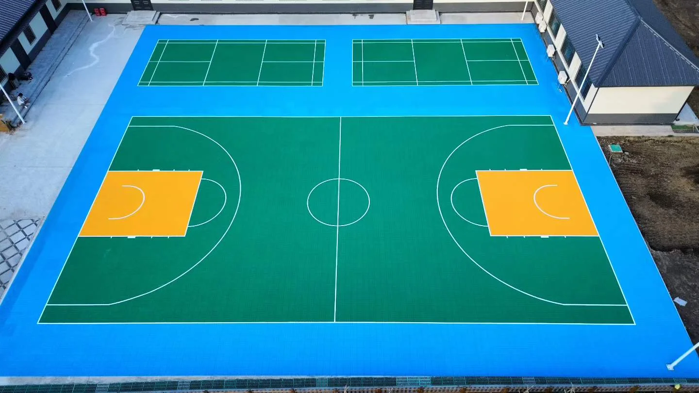 Elevated view of the basketball and adjacent racket-sport areas.