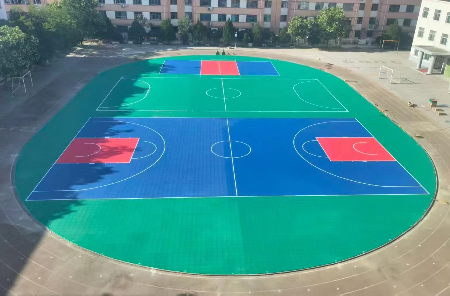 Three basketball courts within the school courtyard.